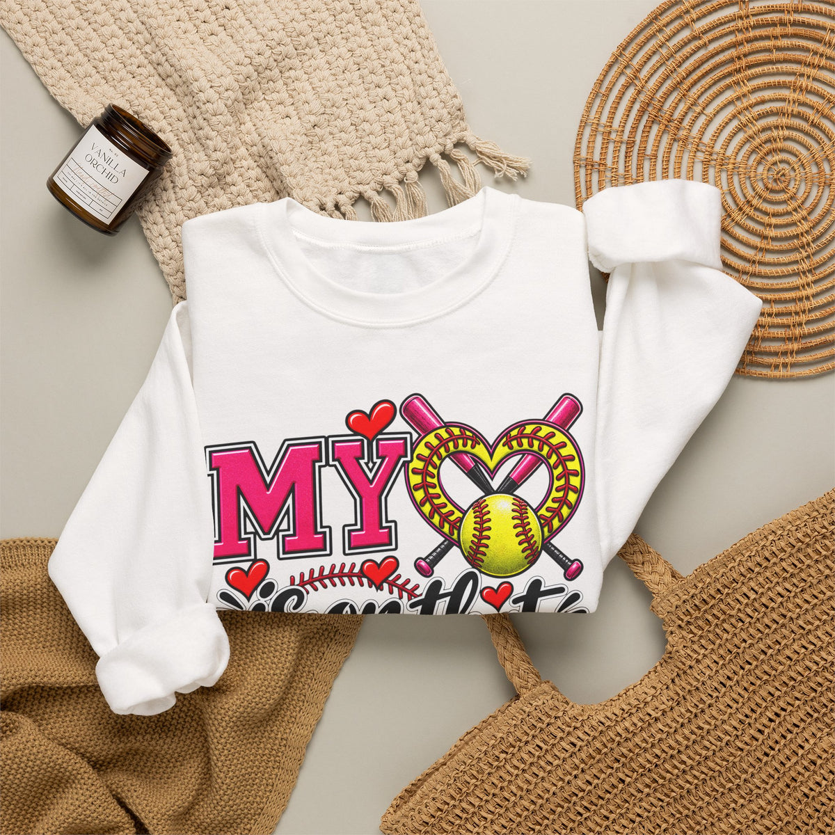 White sweatshirt close-up of front graphic with hearts and softball ball print