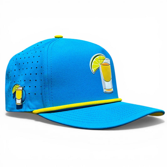 Blue snapback golf cap with yellow trim and front tequila-lime ball marker holder.