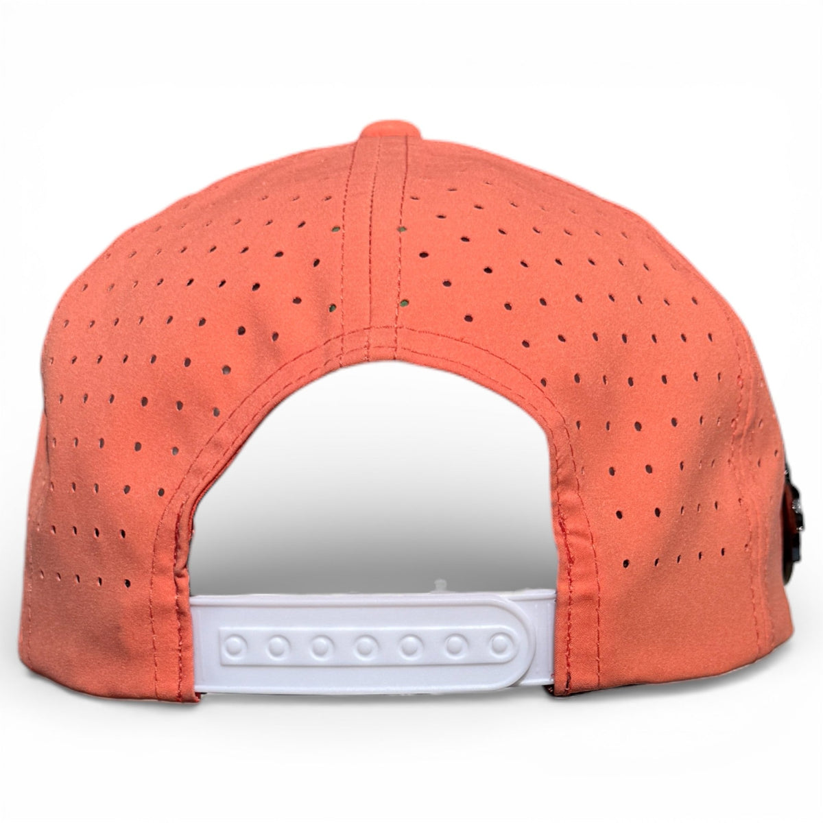 Back view of orange snapback golf hat with perforated crown and white adjust strap