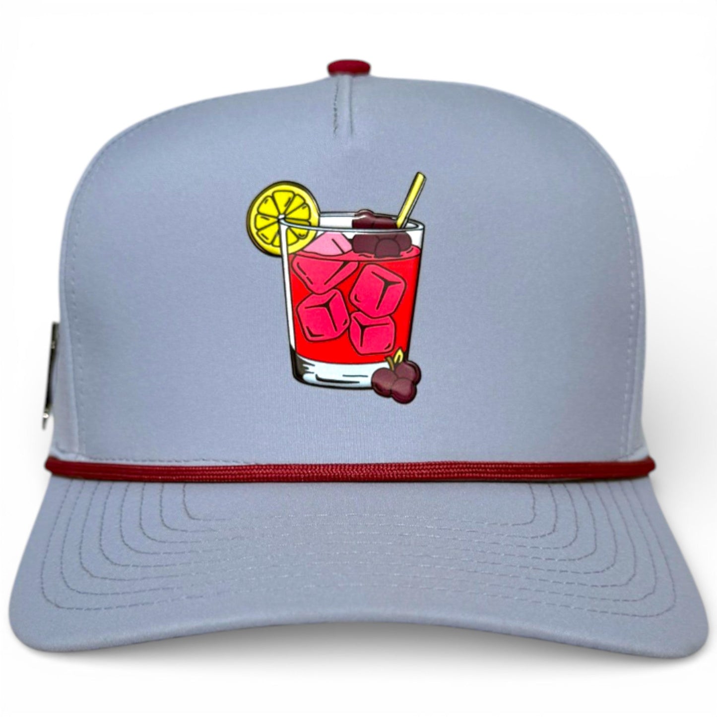 Golf snapback cap, light gray front panel with perforations and attached ball marker