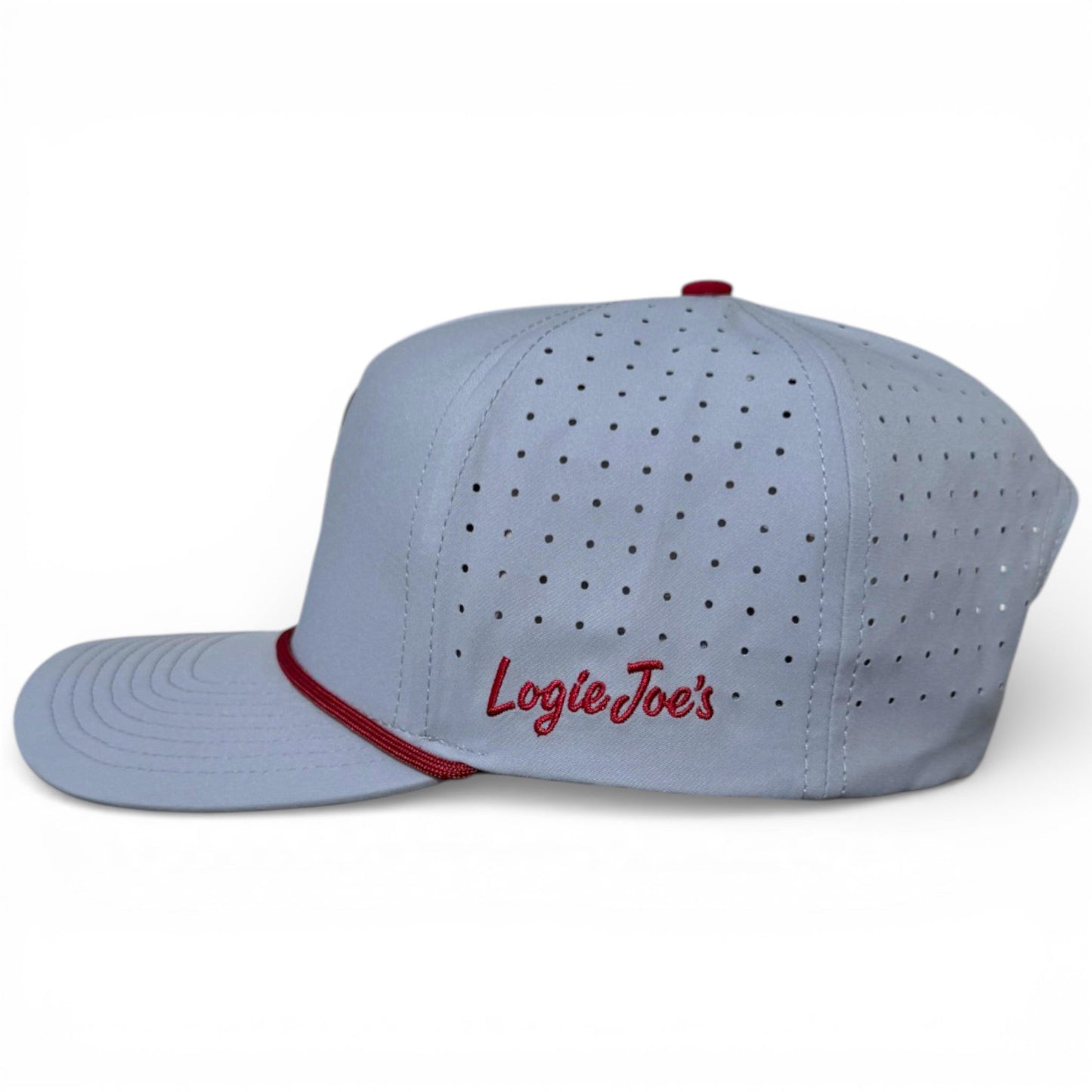 Light gray golf snapback cap with perforations, red brim trim, and Logie Joe’s logo