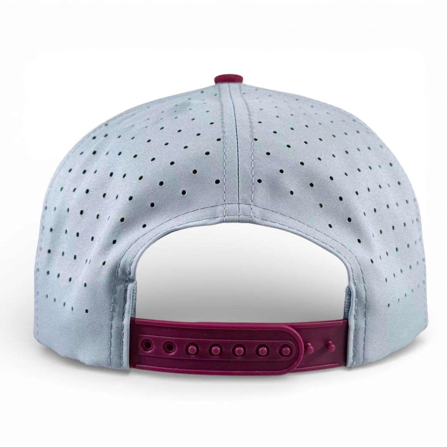 Light gray golf snapback cap back view with perforations and adjustable burgundy strap