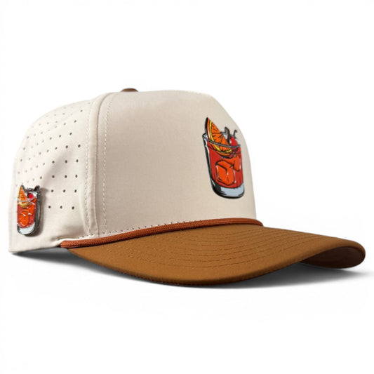 Two-tone golf snapback cap, perforated cream crown with brown bill and front logo patch