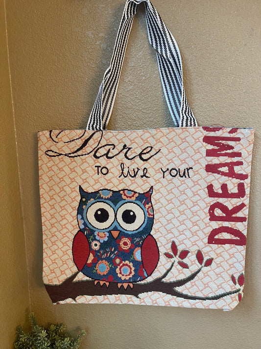 Canvas tote bag with owl graphic print, striped handles, open top.