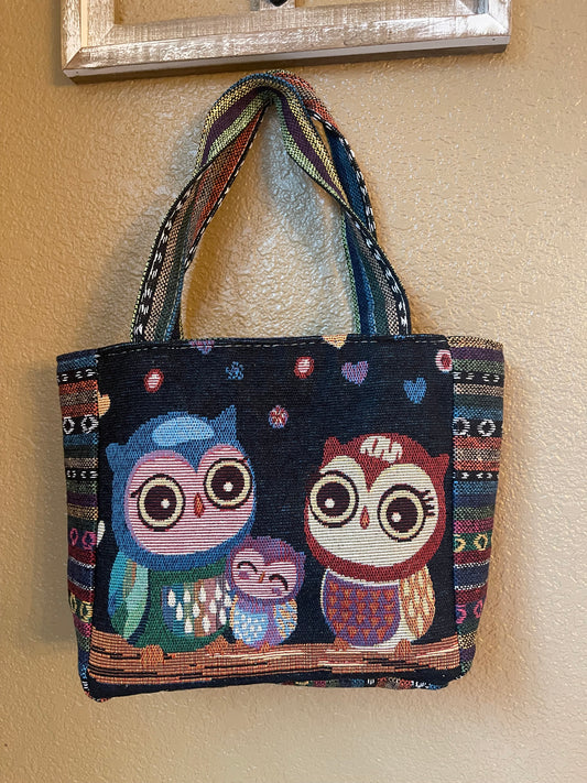 Canvas tote bag in dark navy with colorful owl print and fabric handles