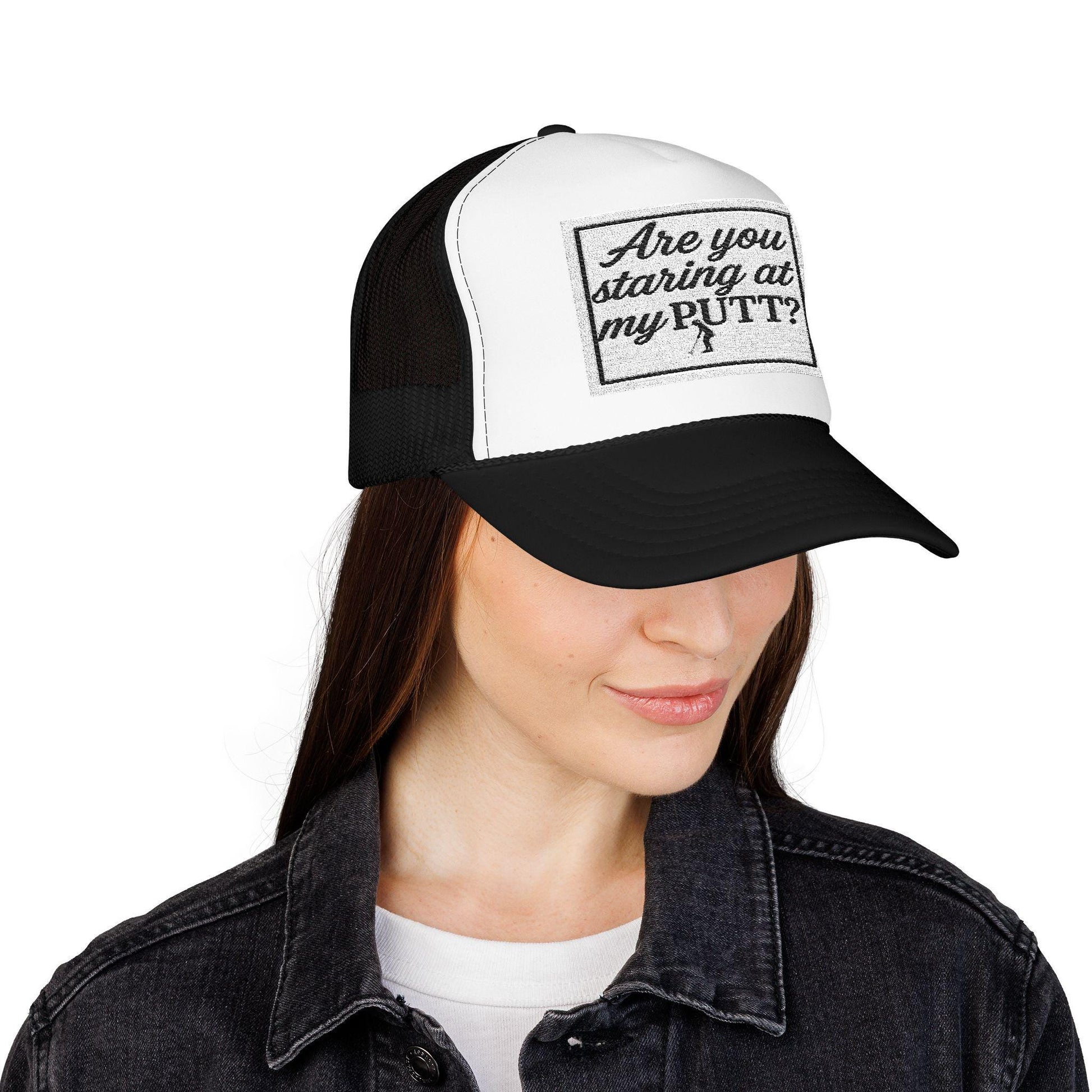 Black and white golf trucker hat with 'Are you staring at my Putt' front patch